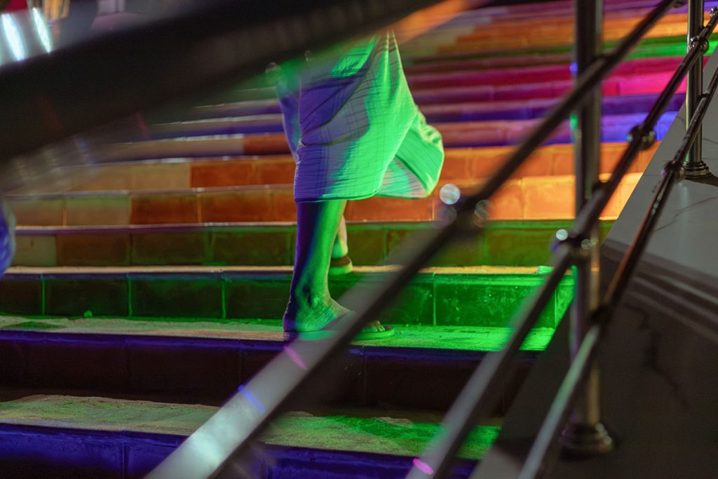 Chromatic Walk  Man climbing stairs.