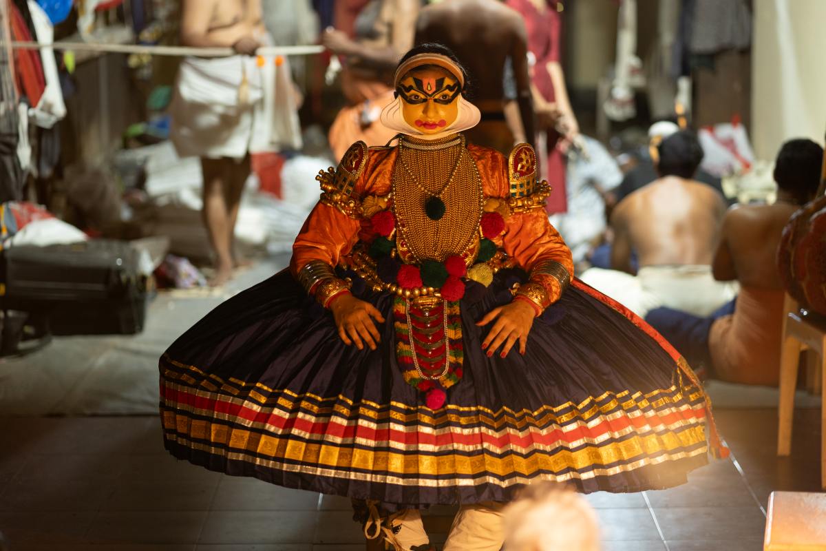 Crafting Legends applying makeup to a Kathakali performer.