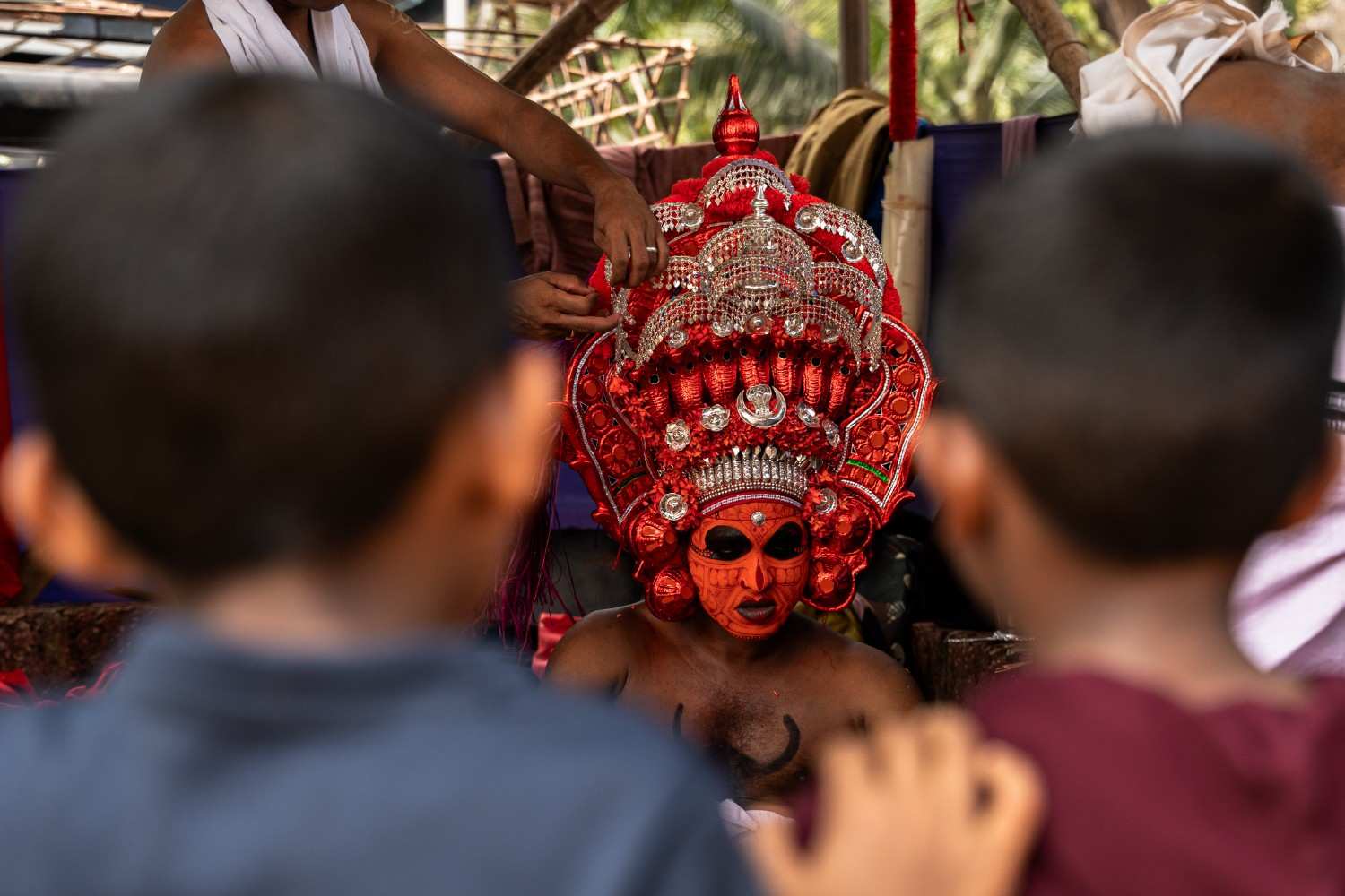 Artist prepares for transformation into theyyam 