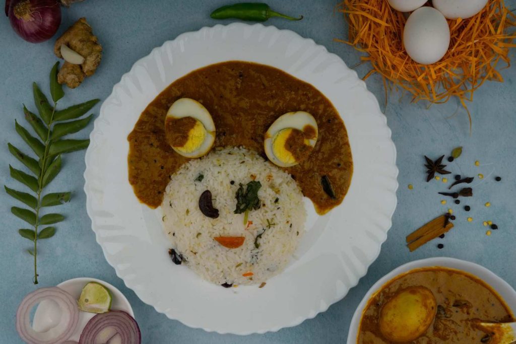 Egg Delight plated with rice and flavorful curry.