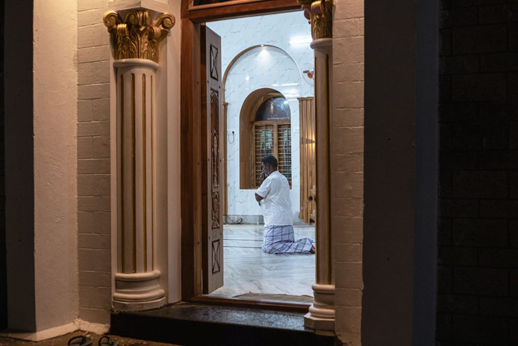 Framed Faith   Man praying in church