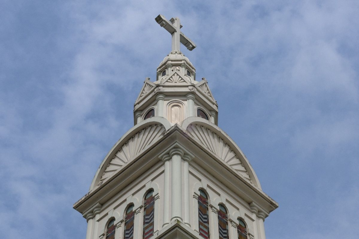 hallowed pillar of cross with designs