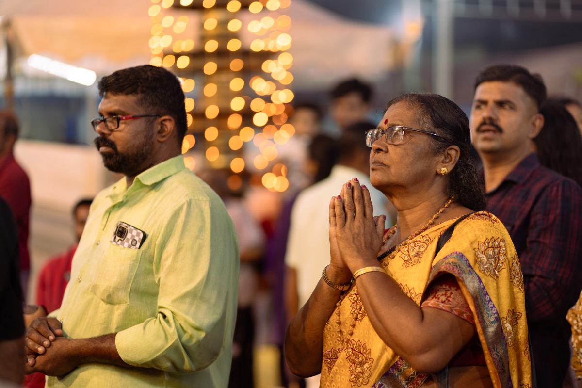 A woman doing Namaskar with Heartfelt Devotion.