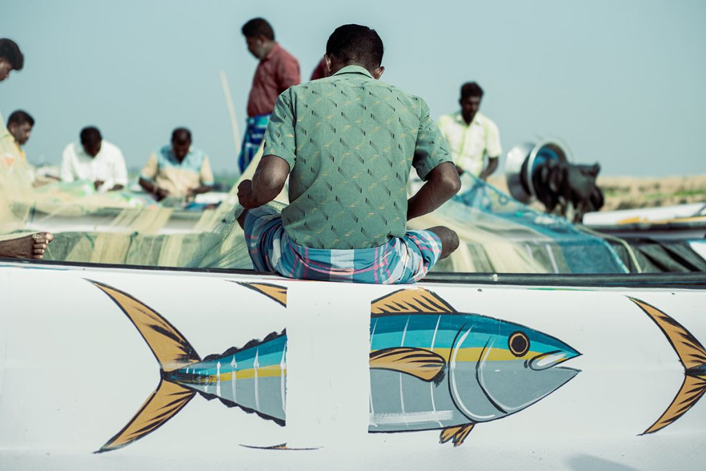 man and sea, a fisherman sitting on a boat.