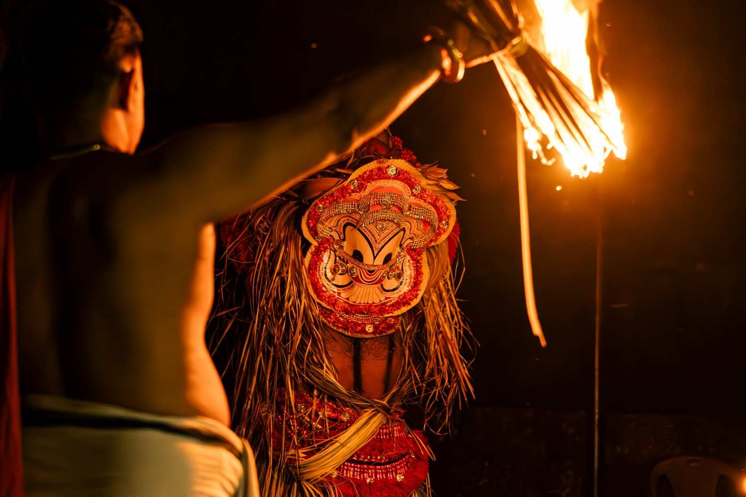 Ritual flames during theyyam performance