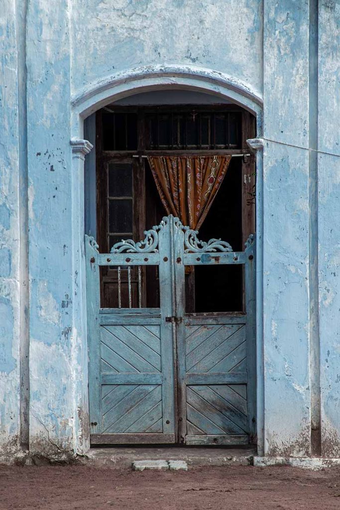 rustic entrance of a heritage house in Manapad.