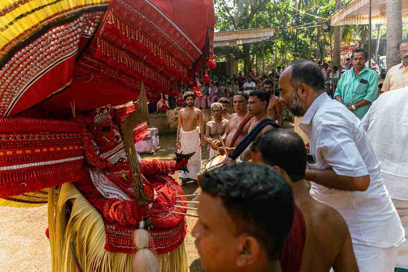 Sacred exchange between theyam and worshippers