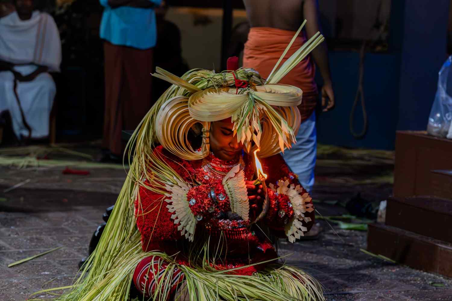 Sacred prayer by theyyam performer 
