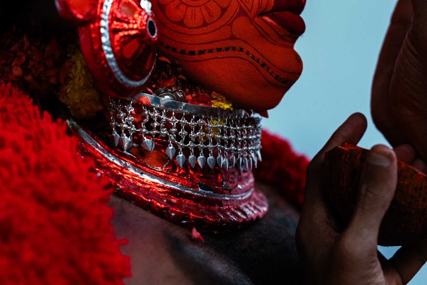 sacred transformation of a theyyam performer