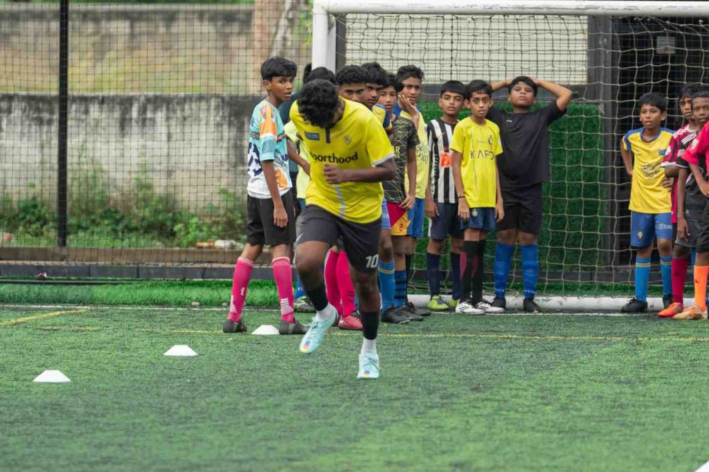 Speed in Sync: Coach demonstrating a sprint.