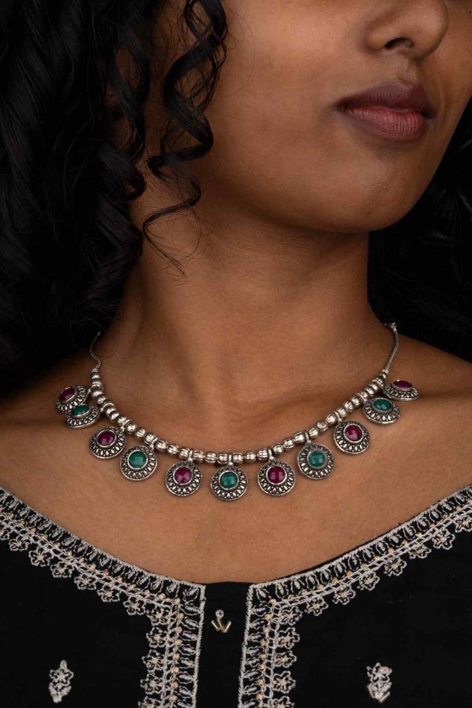 Timeless Elegance in oxidized silver necklace with vibrant gemstones.