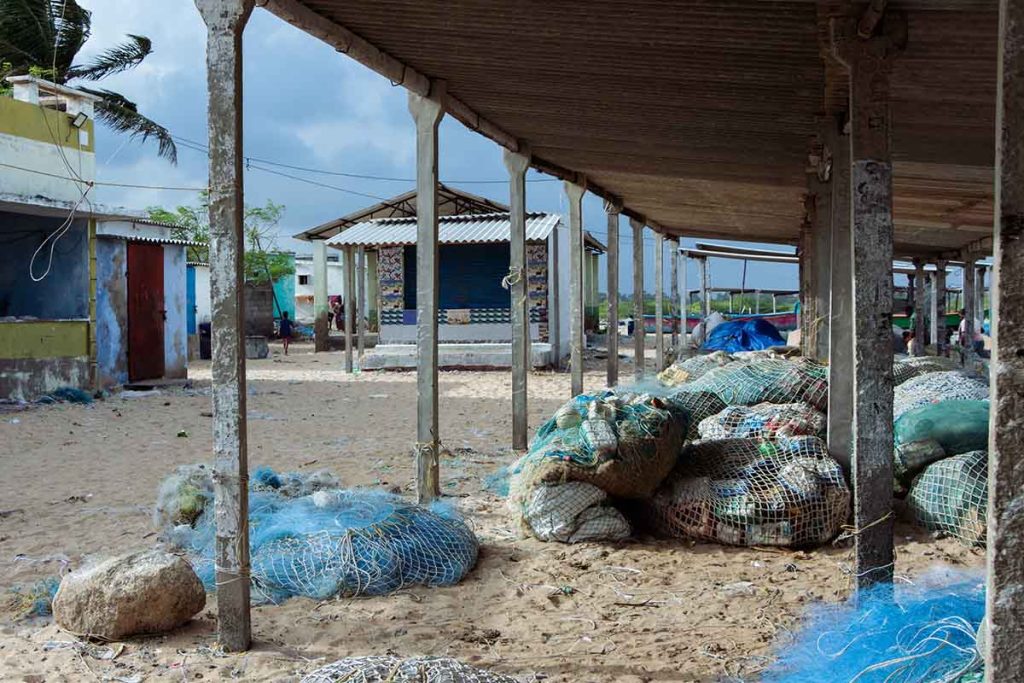 Waiting for Waves Fishing nets at the fisherman hub. 