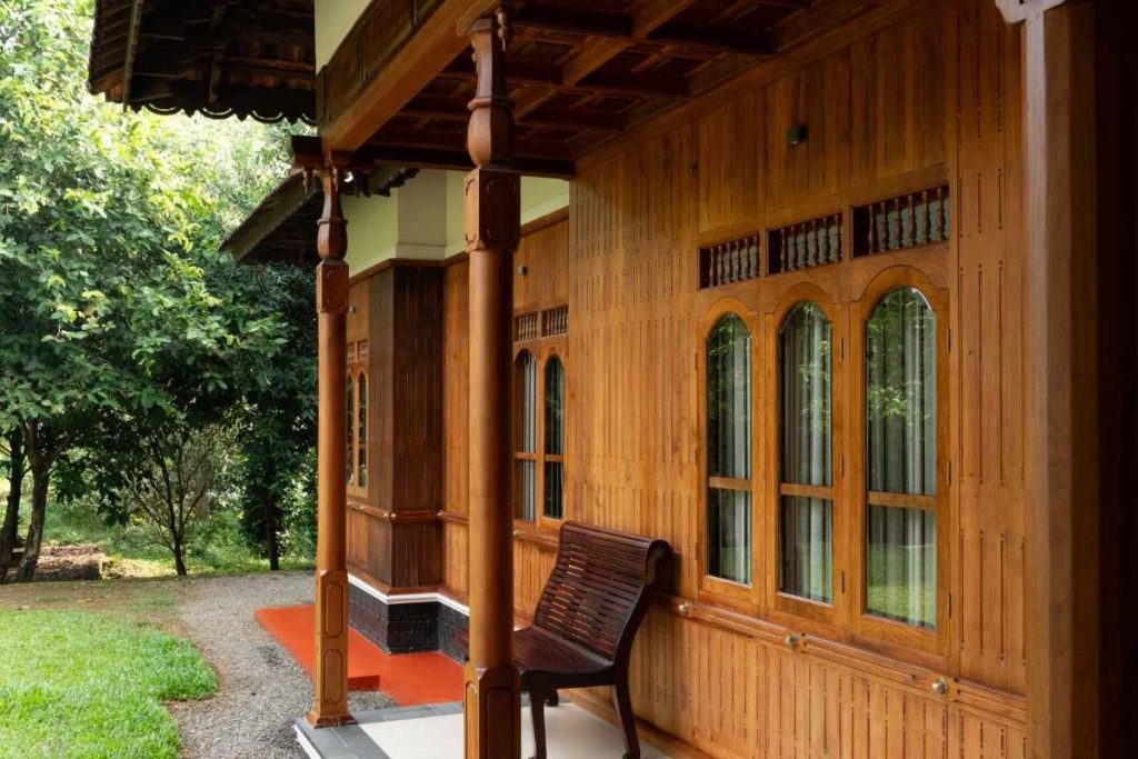 Wooden Kerala house showcasing timber’s beauty and strength.