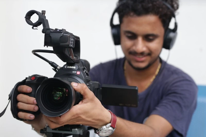 Student filming with a Canon cinema camera, cinematography courses admission open in India