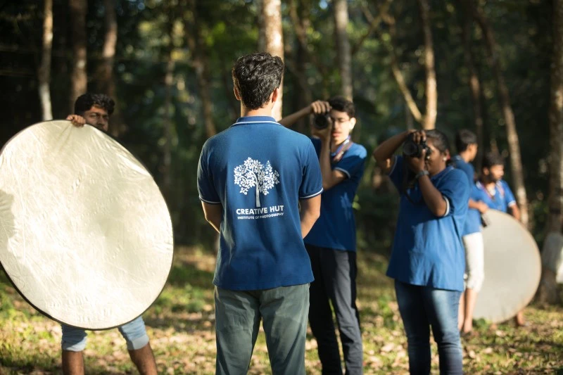 Photography students on location shoot, admissions open for photography courses in Kerala