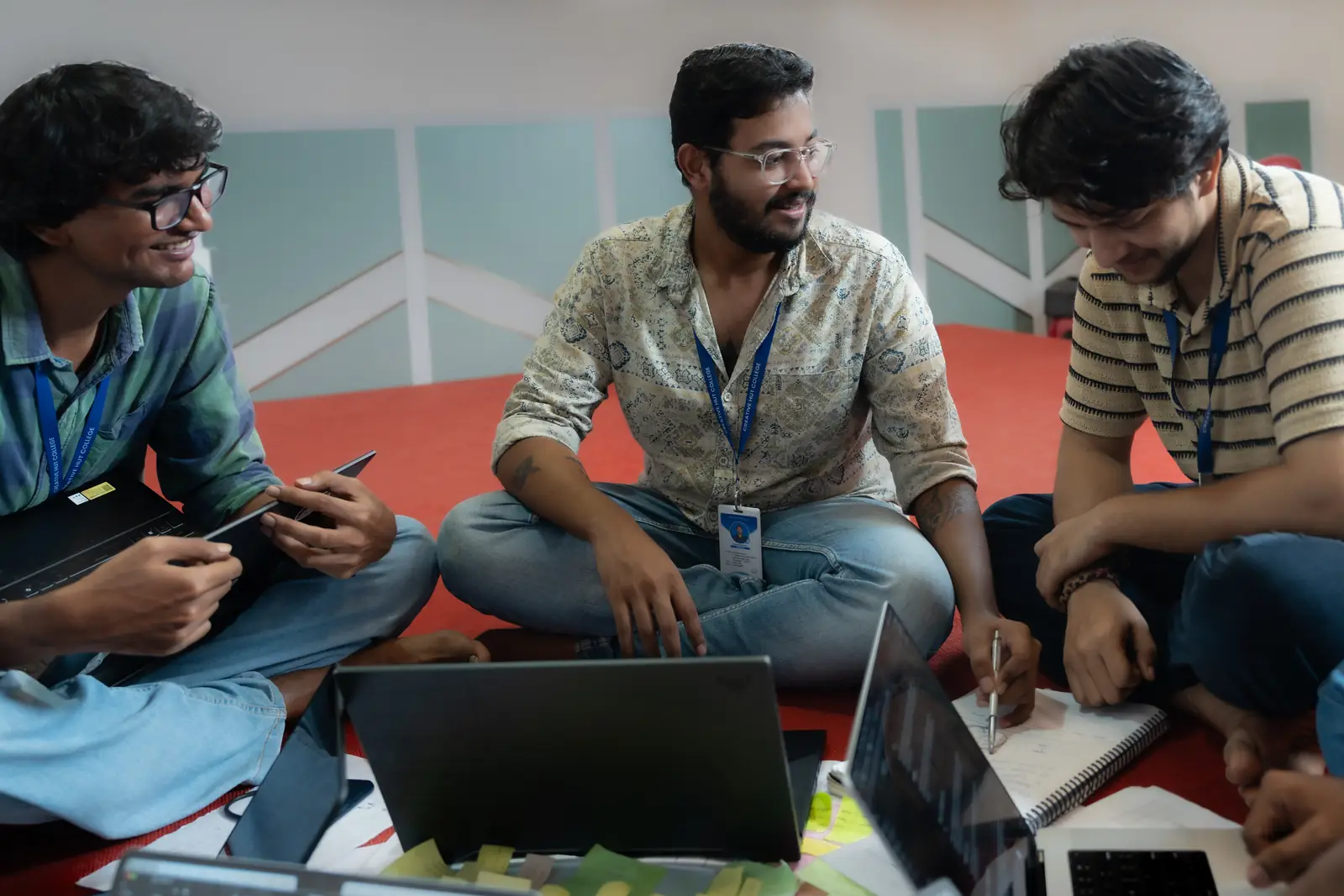 AI filmmaking course students collaborating on laptops at Creative Hut Academy, Keralam