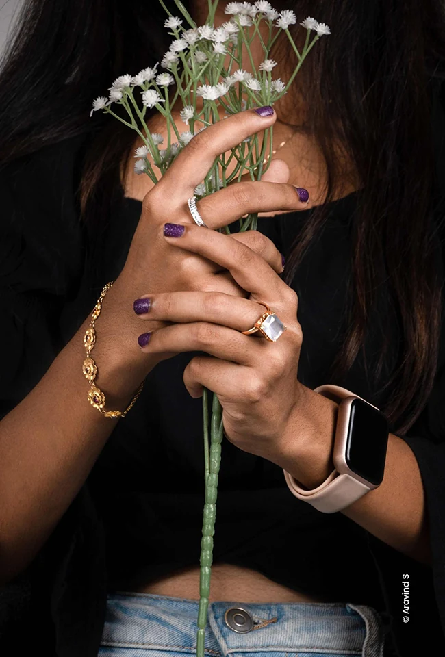 Hands holding baby's breath flowers with a ring and watch, advertising photograph by Aravind S, Creative Hut Academy