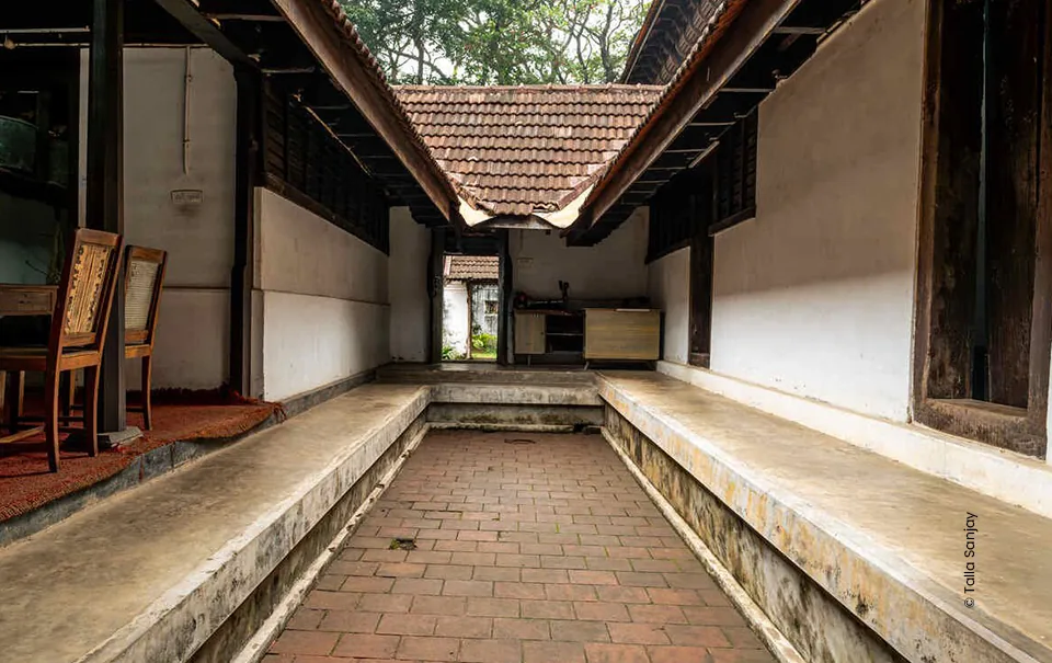 Kerala courtyard with a tiled roof and stone ledge, architecture photograph by Sanjay Talla, Creative Hut Academy