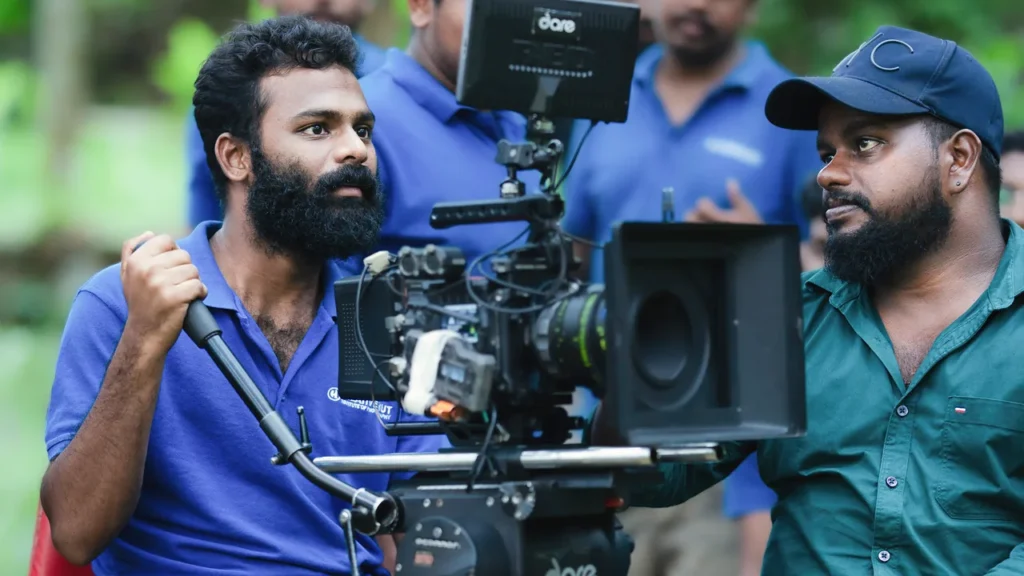 Photography and cinematography courses in India: Creative Hut Academy students operating a professional cinema camera with an external monitor during an outdoor practical cinematography training session.