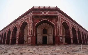 Red sandstone tomb arches in soft light, architecture photograph by Aman, Creative Hut Academy