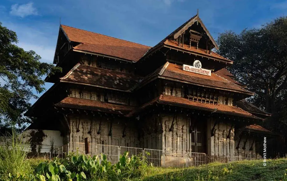 Traditional Kerala wooden palace with tiered roofs, architecture photograph by Rohit Mathew, Creative Hut Academy
