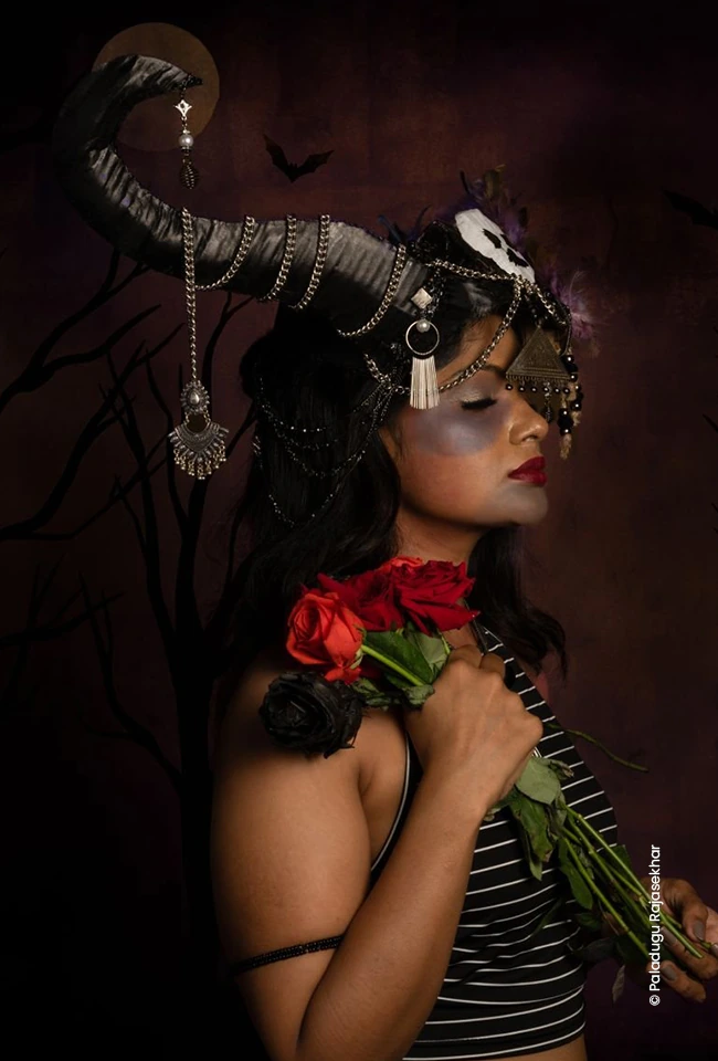 Woman in a horned headpiece holding red roses, advertising photograph by Paladugu Rajasekhar, Creative Hut Academy